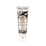 Tube of Honey Almond hand cream with decorative packaging on a white background. Available at Be Charmed