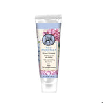 Hand cream tube with floral design on a white background. Available at Be Charmed