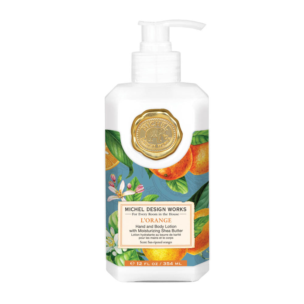 Lotion bottle with floral design and Michel Design Works branding on a white background. Available at Be Charmed