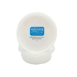 A white plastic container with a blue label displaying 'Molly's Apothecary Marshmallow Fluff' along with the scent marked as 'Golden'. The container appears to be sealed and is presented against a plain background. Available at Be Charmed