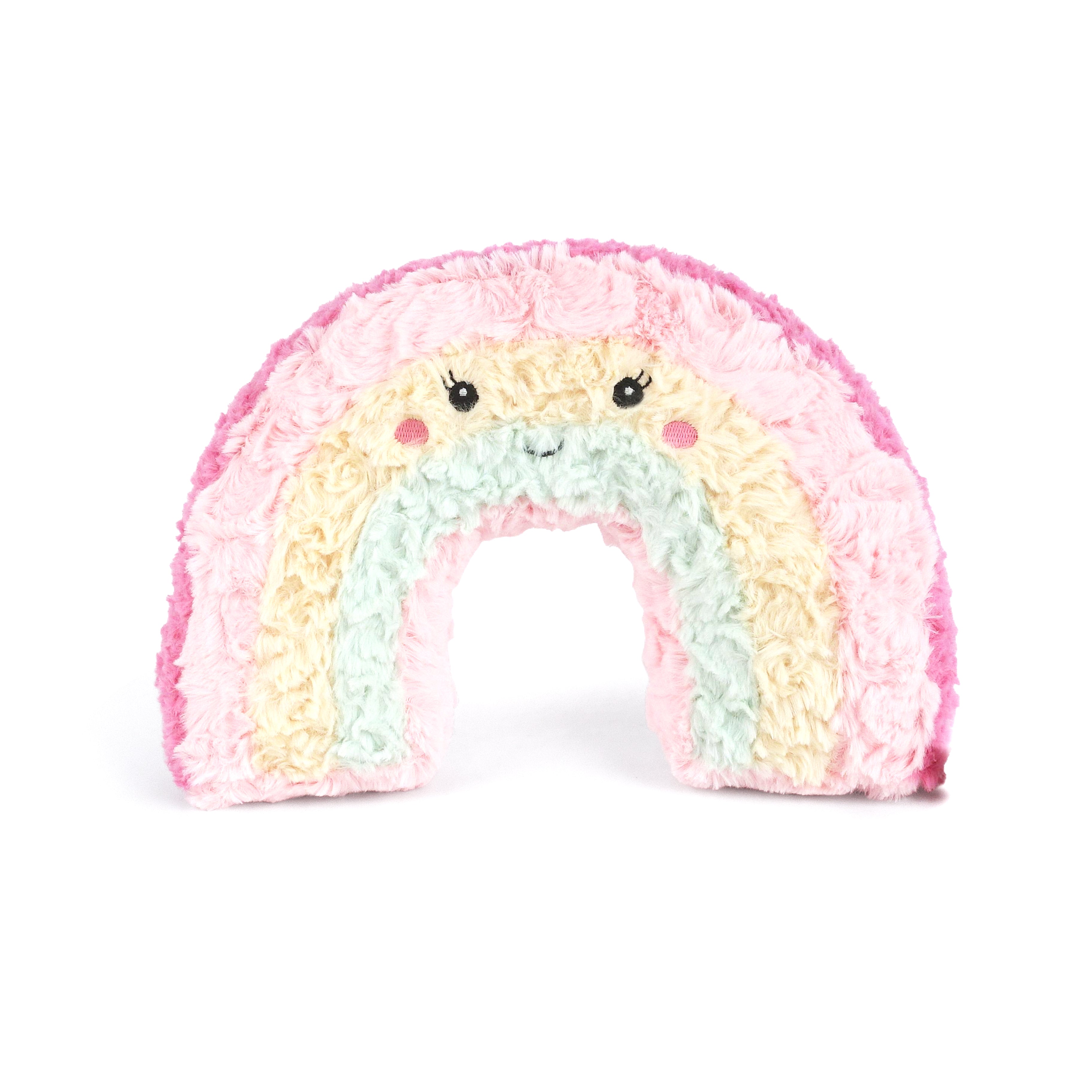 Pastel rainbow-shaped plush toy with a white background. Available at Be Charmed