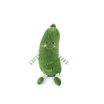 Plush toy pickle with a happy face on a white background. Available at Be Charmed