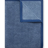Navy Chappy Wrap Harborview Herringbone Blanket – Original size throw in a classic light grey herringbone pattern. Plush, durable, and machine washable. A cozy neutral accent for the home or perfect gift. Available at Be Charmed.
