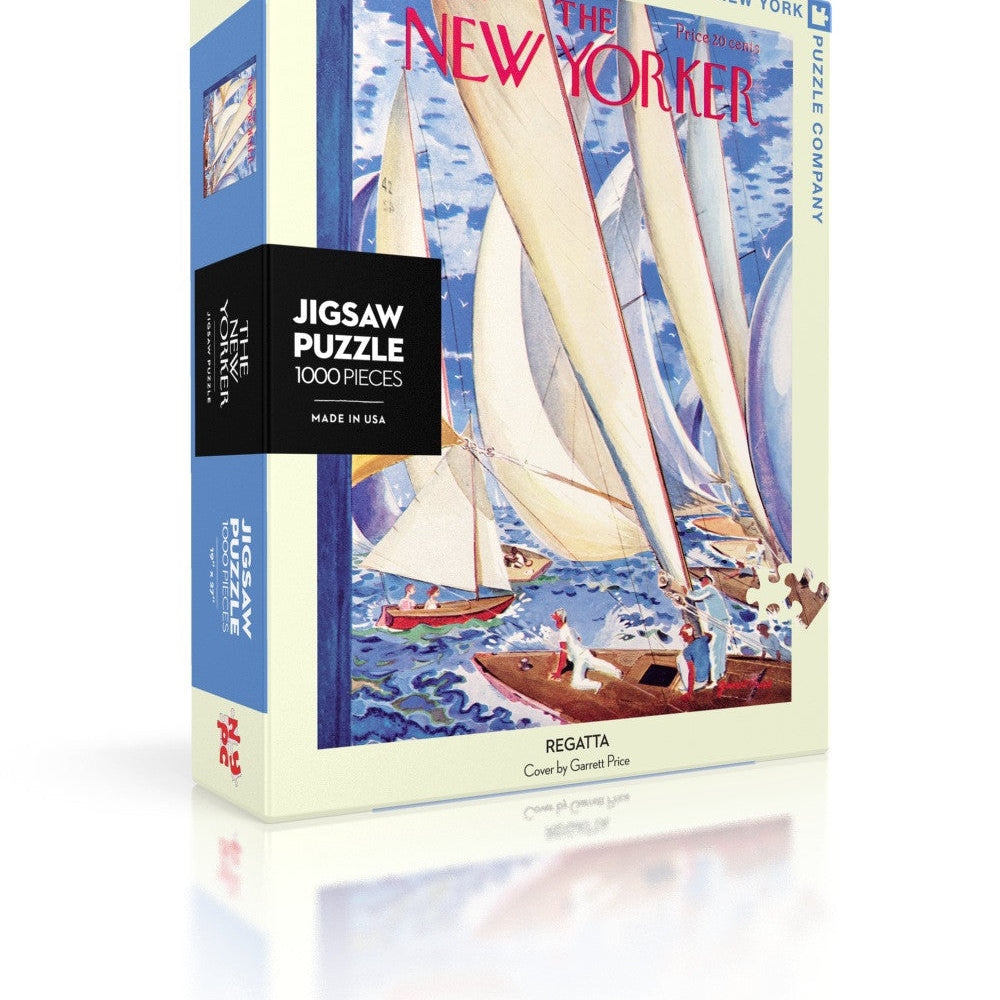 A puzzle box cover featuring a colorful image of sailboats and a sea shore, with 'The New Yorker' magazine branding and the text 'Jigsaw Puzzle'. Available at Be Charmed