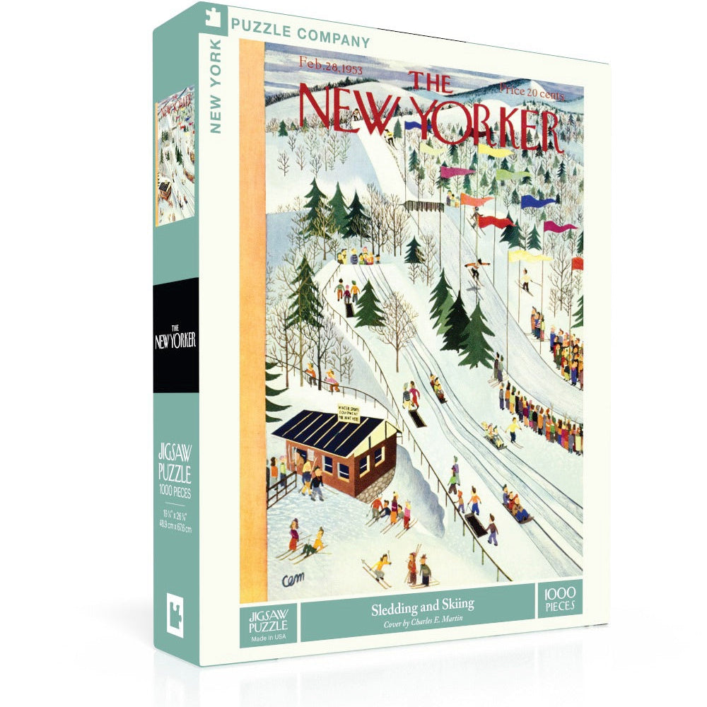 New York Puzzle Co Sledding and Skiing 1000 Piece Puzzle – winter sports jigsaw with snowy fun scene. Available at Be Charmed