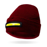 Burgandy beanie with a black and yellow stripe on a white background. Available at Charmed