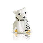 A mini figurine of a polar bear wearing a black and white checkered scarf, sitting on a white base that resembles a frosty surface. Available at Be Charmed