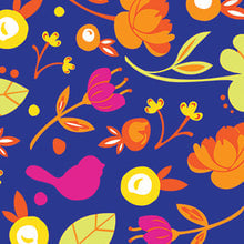 A pack of cocktail napkins featuring a colorful floral and parrot pattern on a blue background. Available at Be Charmed