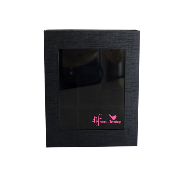 Black mini charm box with a pink logo on a white background. Available at Be Charmed