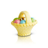 A miniature yellow egg basket charm with a handle, containing various colored eggs and a golden egg, meant for use as a dish decoration. Available at Be Charmed