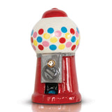 A decorative gumball machine Nora Fleming Mini with a vibrant red base, white upper half with multicolored polka dots, and a metallic gumball dispenser. Available at Be Charmed