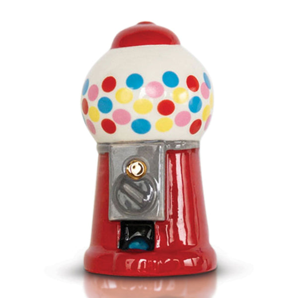 A decorative gumball machine Nora Fleming Mini with a vibrant red base, white upper half with multicolored polka dots, and a metallic gumball dispenser. Available at Be Charmed