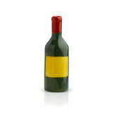 Nora Flelming Mini -bottle with a green body, red cap, and yellow label on a white background. Available at Be Charmed