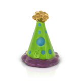 A Nora Fleming Mini ceramic mini figurine resembling a party hat with a green base, blue polka dots, and a gold-colored top. Available at Be Charmed