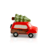 A red mini charm depicting a car with a green tree on top, designed by Nora Fleming. Available at Be Charmed