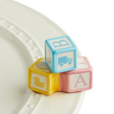 Nora Fleming “Ohhh, Baby!” Mini accent featuring an adorable baby-themed design for trays, platters, and celebrations. Available at Be Charmed