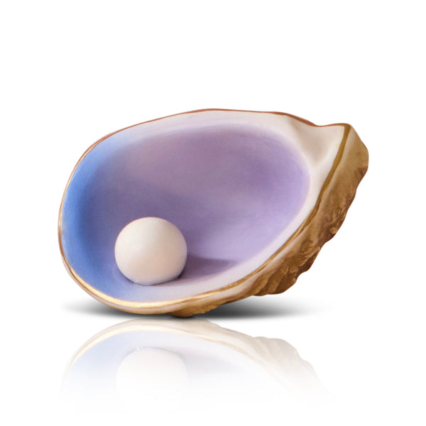 Pearl inside an open oyster shell Nora Fleming Mini on a white background. Available at Be Charme