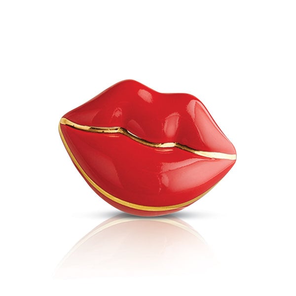 A red and gold colored Nora Fleming mini charm in the shape of a stylized lip. Available at Be Charmed