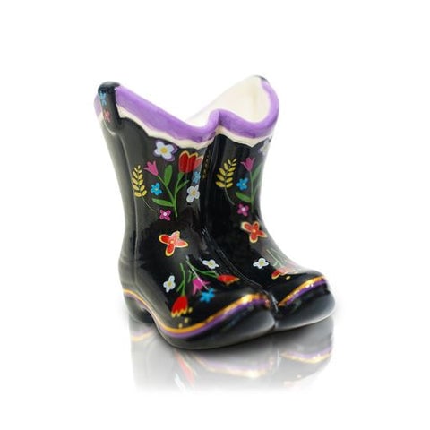 A miniature decorative cowboy boot Nora Fleming Mini with colorful floral patterns and a purple rim. Available at Be Charmed