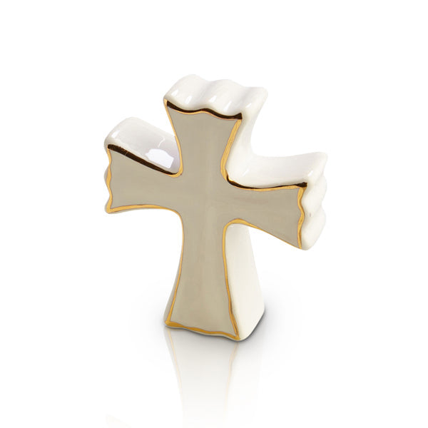 Nora Fleming “White Cross” Mini accent featuring an elegant white cross design for religious celebrations and décor. Available at Be Charmed