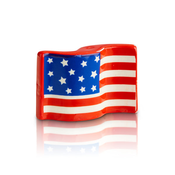 Nora Fleming Stars & Stripes Forever Mini ceramic attachment featuring a patriotic American flag design. Perfect for summer gatherings. Available at Be Charmed.