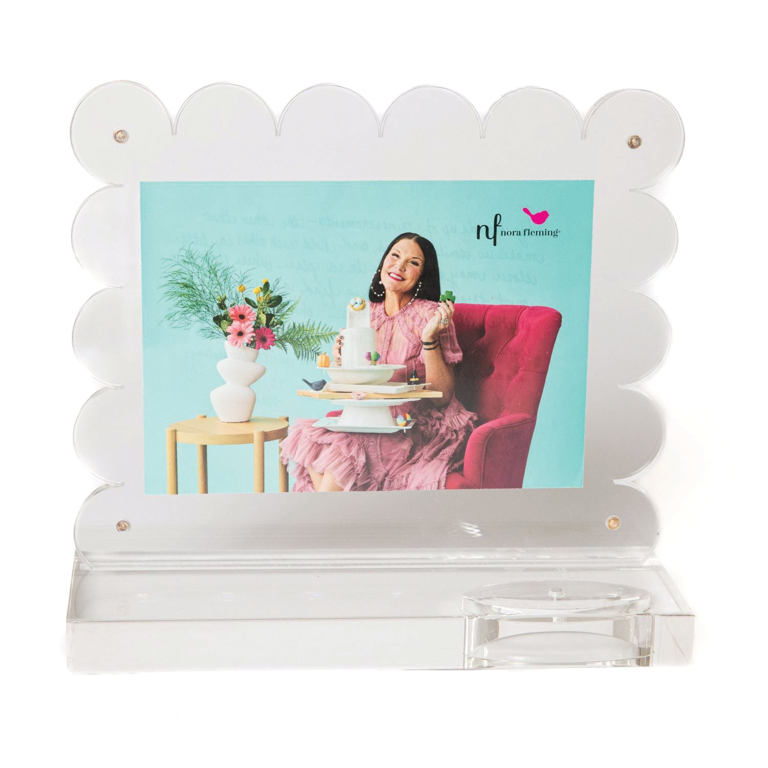 Decorative photo frame with a woman in a pink dress and floral arrangement on a green background. Available at Be Charmed