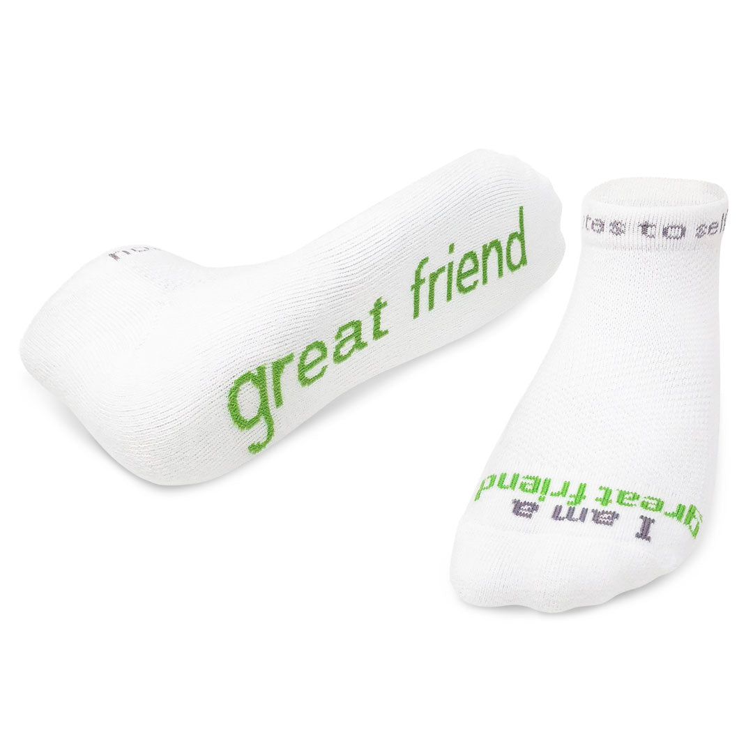 A pair of white crew socks with the phrase 'great friend' printed in green text across the top. Available at Be Charmed