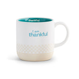 White mug with text 'I am thankful' on a white background. Available at Be Charmed