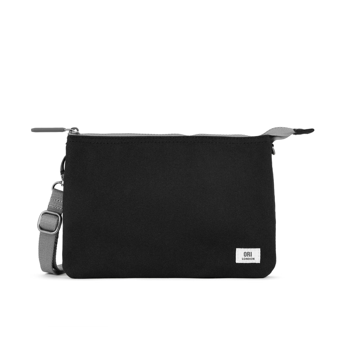 A lightweight and sustainable Ash Ori Carnaby Crossbody bag featuring three secure interior compartments, available at Be Charmed.