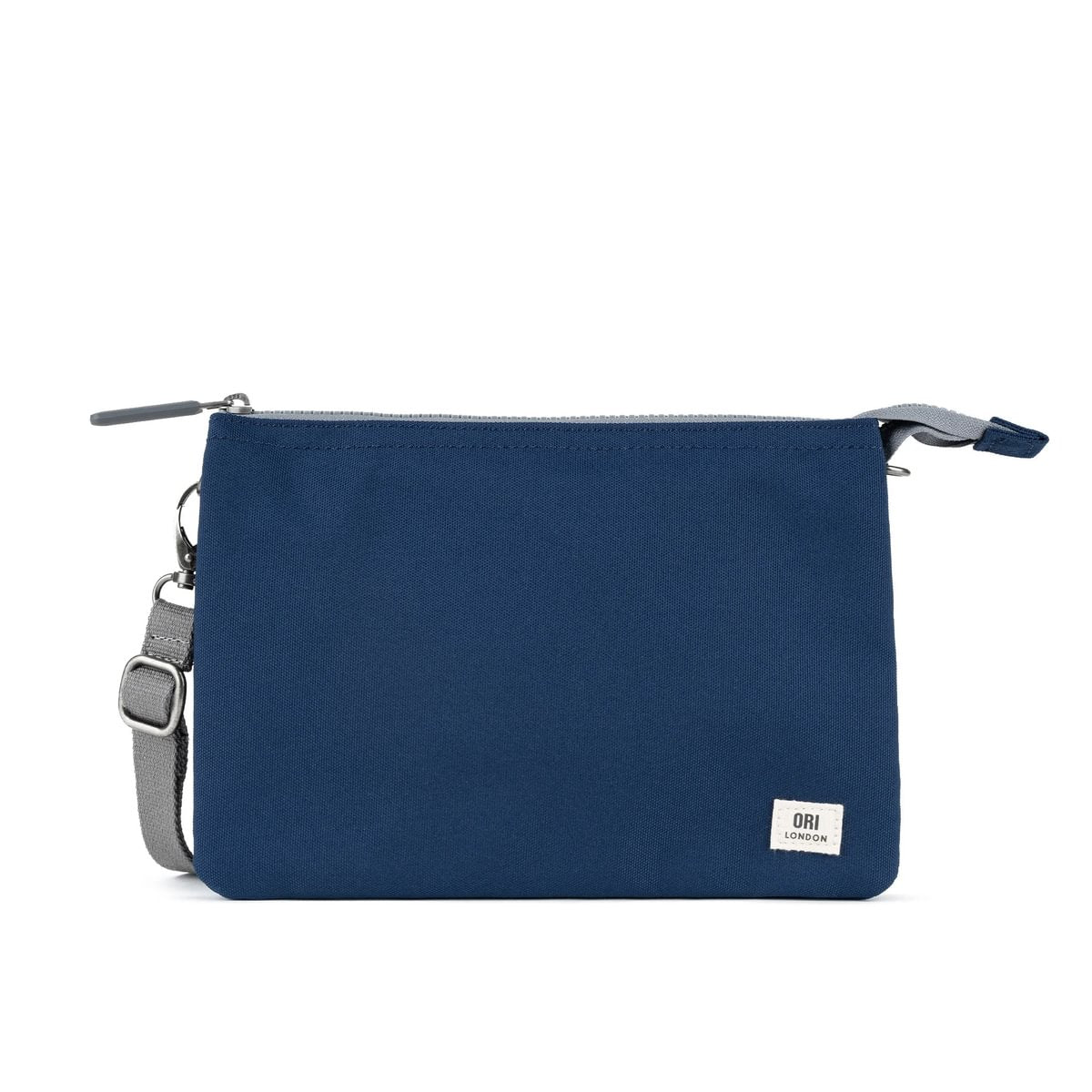 A lightweight and sustainable Crisp Blue Ori Carnaby Crossbody bag featuring three secure interior compartments, available at Be Charmed.
