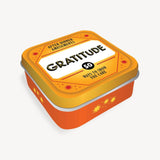 Gratitude Game Tin by On-the-Go Amusements – compact travel-sized card set with thoughtful prompts to inspire reflection, mindfulness, and gratitude for all ages, available at Be Charmed.
