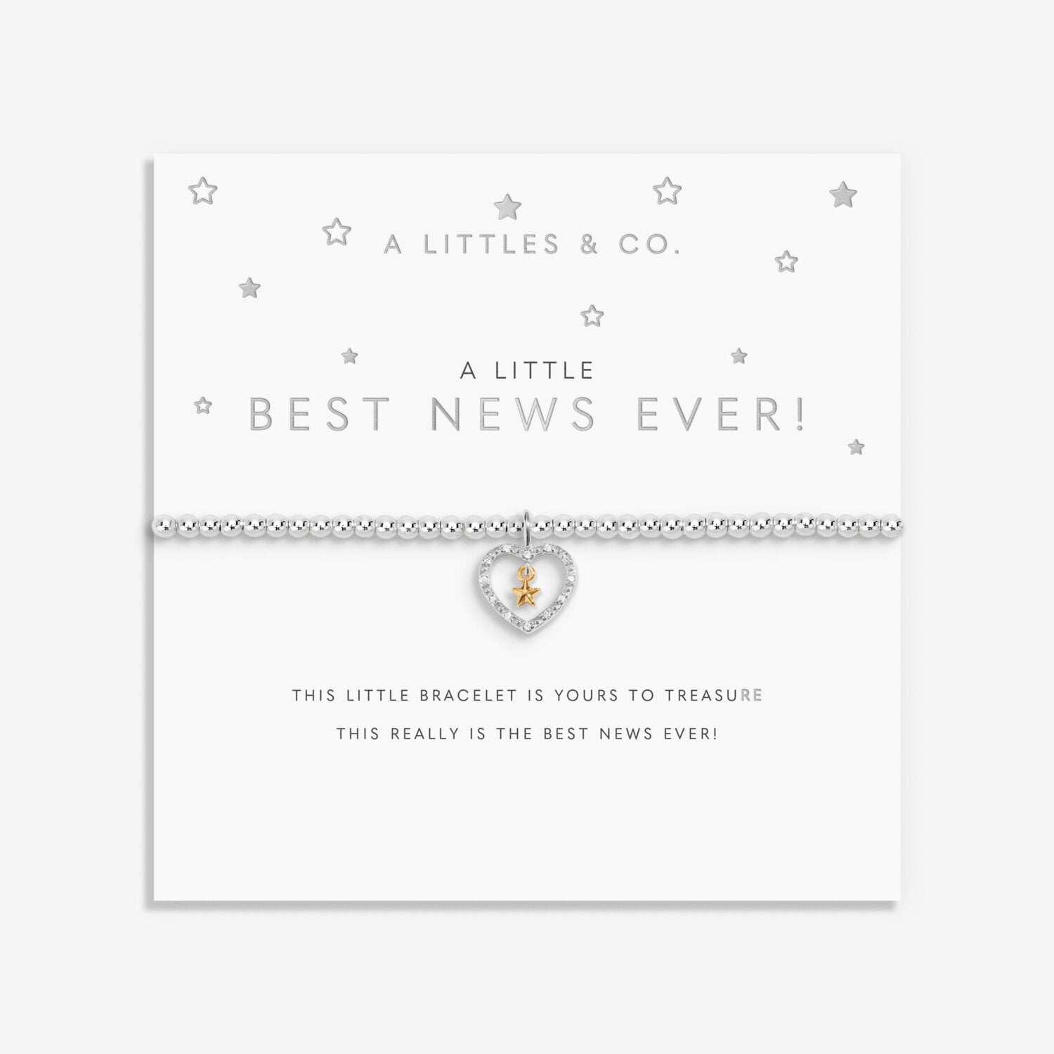 Bracelet with heart charm on a white card with text. Available at Be Charmed