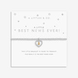 Bracelet with heart charm on a white card with text. Available at Be Charmed