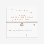 Heart-shaped bracelet on a branded card with 'A Littles & Co.' text. Available at Be Charmed