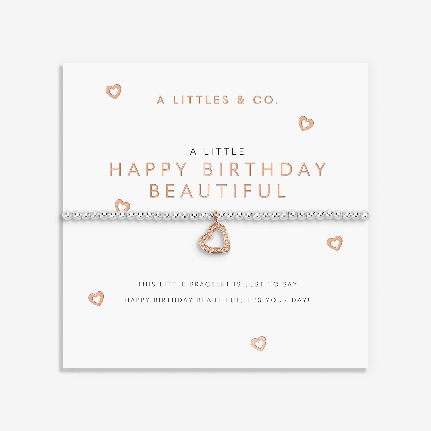 Heart-shaped bracelet on a branded card with 'A Littles & Co.' text. Available at Be Charmed
