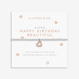 Heart-shaped bracelet on a branded card with 'A Littles & Co.' text. Available at Be Charmed