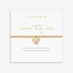 Gold bracelet with heart charm on a white card with 'A Littles & Co.' text. Available at Be Charmed