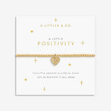 Gold bracelet with heart charm on a 'A Littles & Co.' branded card. Available at Be Charmed