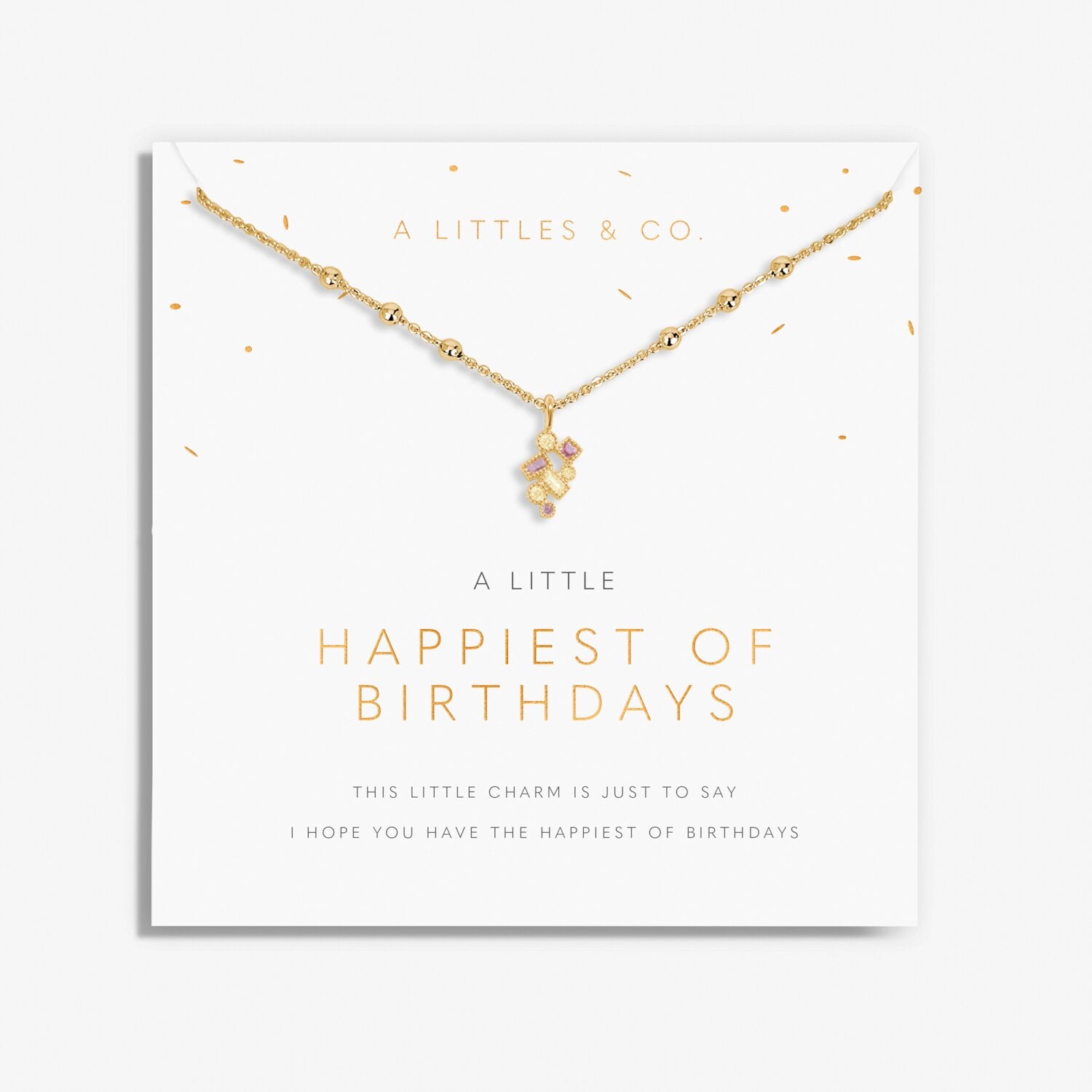 Gold necklace with a small charm on a branded card with text. Available at Be Charmed