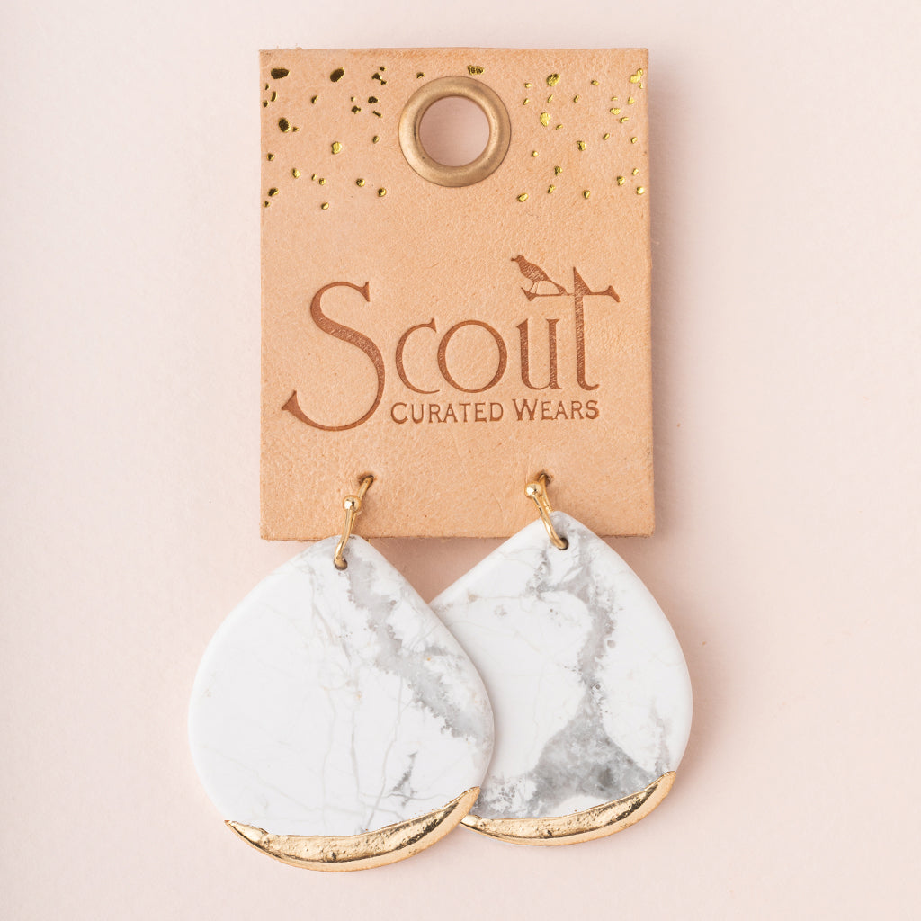 Scout Curated Wears Earrings Stone Dipped Teardrop Fossil Coral/Gold;  Marble-patterned earrings on a Scout Curated Wears card against a beige background. Available at Be Charmed
