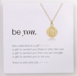 On card enewton Be You 16″ gold‑filled necklace with small disc charm engraved “Be You” for self‑expression. Worry‑free wear. Available at Be Charmed.