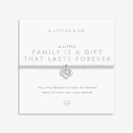 Silver heart-shaped bracelet on a white card with text about family and forever, brand 'A Littles & Co.' visible. Available at Be Charmed