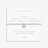 Silver heart-shaped bracelet on a white card with text about family and forever, brand 'A Littles & Co.' visible. Available at Be Charmed