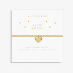 Gold heart-shaped bracelet on a card with 'A Littles & Co.' branding. Available at Be Charmed