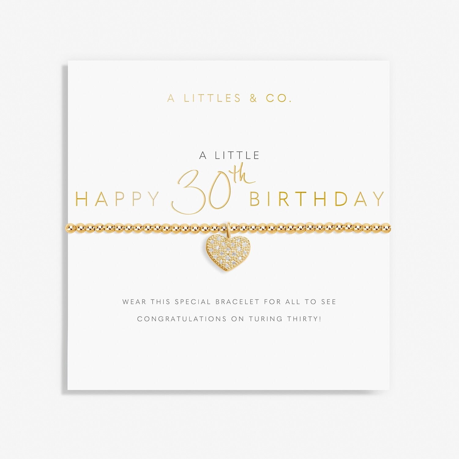 Gold heart bracelet on a card with 'Happy 30th Birthday' text. Available at Be Charmed