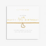 Gold heart bracelet on a white card with 'A Littles & Co' text. Available at Be Charmed