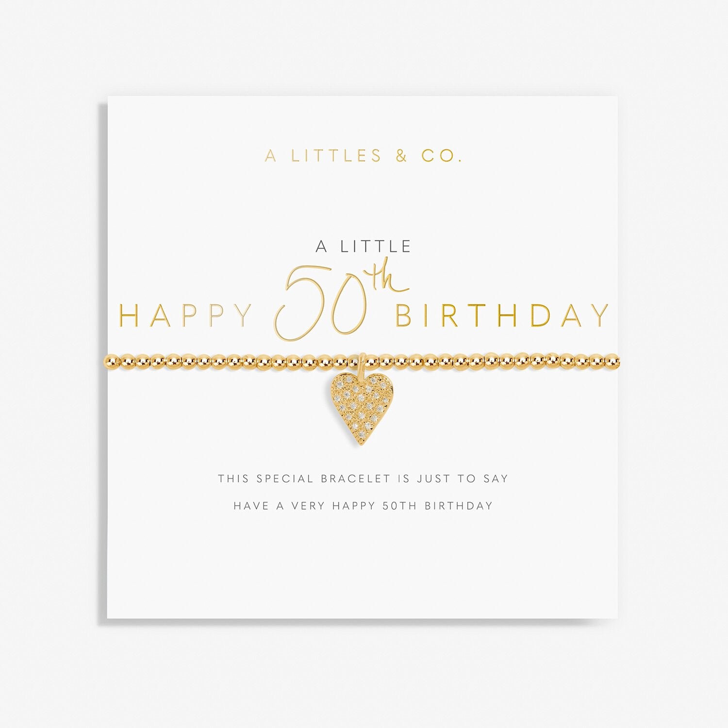 Gold heart bracelet on a card with 'Happy 50th Birthday' text. Available at Be Charmed