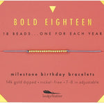 An 18-inch gold-dipped milestone birthday bracelet with a mix of beads, advertised by Lucky Feather, displayed against a red background with text detailing the product features. Available at Be Charmed