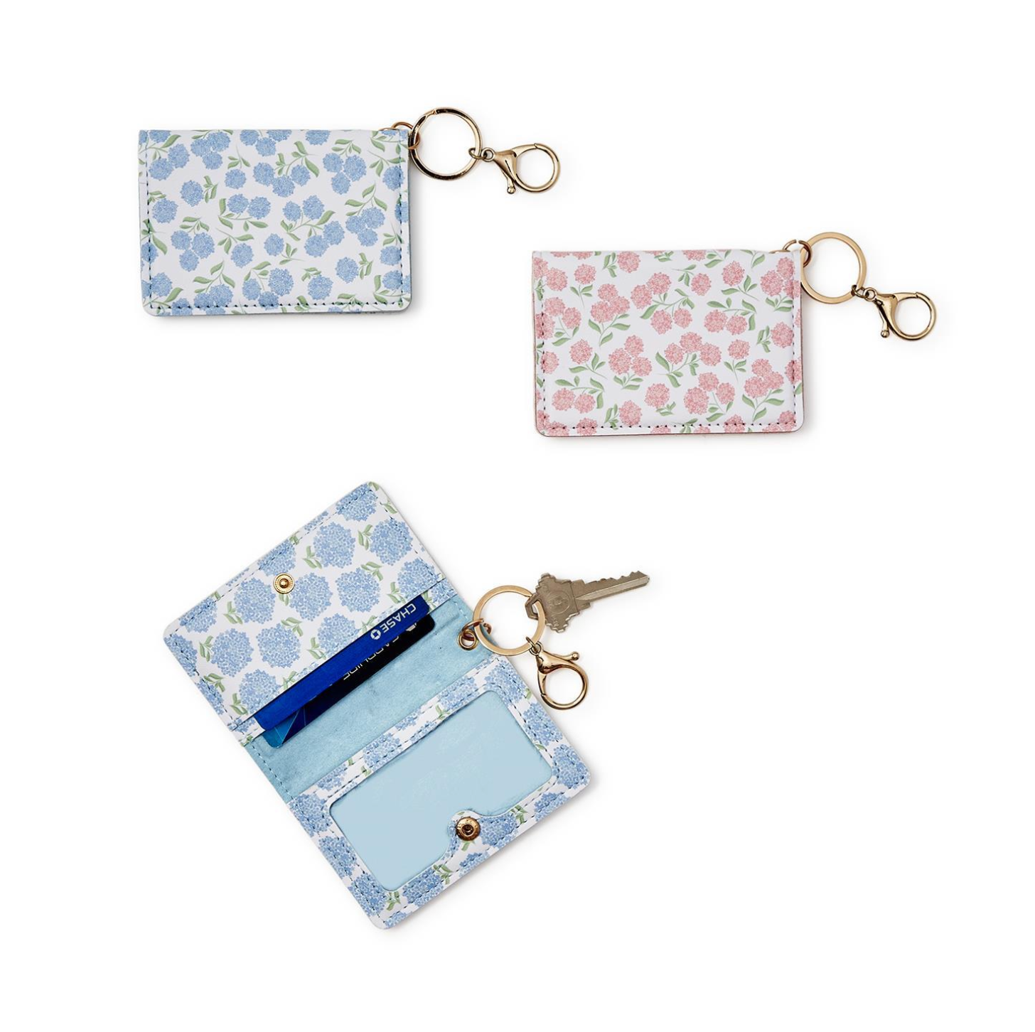 Open view of Set of three floral Hydrangea ID Wallet keychains on a white background. Available at Be Charmed 