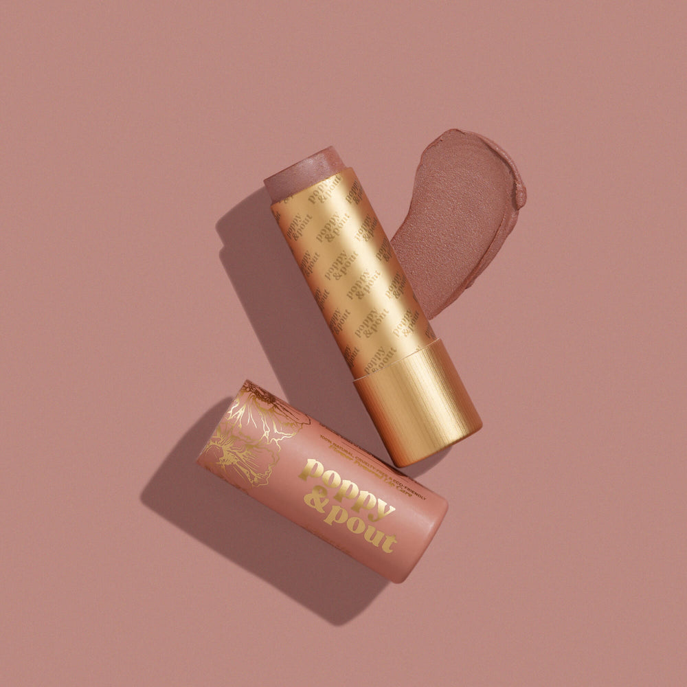 Opened Poppy & Pout Lip Tint. Available at Be Charmed